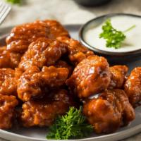 Bbq Tenders · Golden chicken tenders crisp to perfection topped with sweet BBQ sauce.