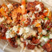 Buffalo Bleu Fries · Buttermilk fried popcorn chicken, on top of our haus fries drizzled with bleu cheese dressin...