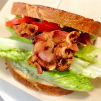Osito Style B.L.T · Double order of applewood smoked bacon, basil aioli, romaine lettuce, tomato, on butter toas...