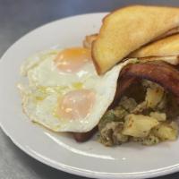 2 Egg Breakfast · Choice of Eggs, Choice of Meat, Choice of Toast, Served with Potatoes.