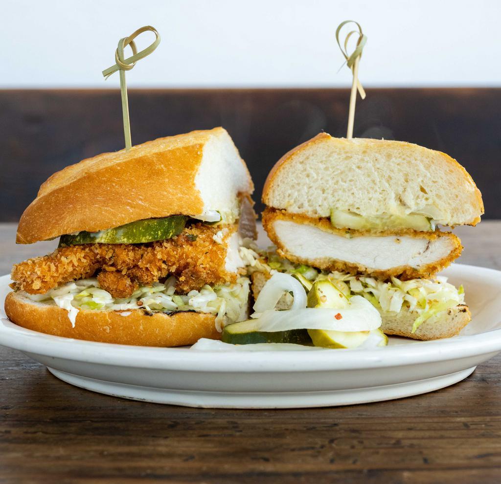 Crispy Chicken Sandwich · Mary's free range organic crispy chicken with caraway-mustard slaw, house made pickles, lemon-herb aioli.  Make it Sweet and Spicy