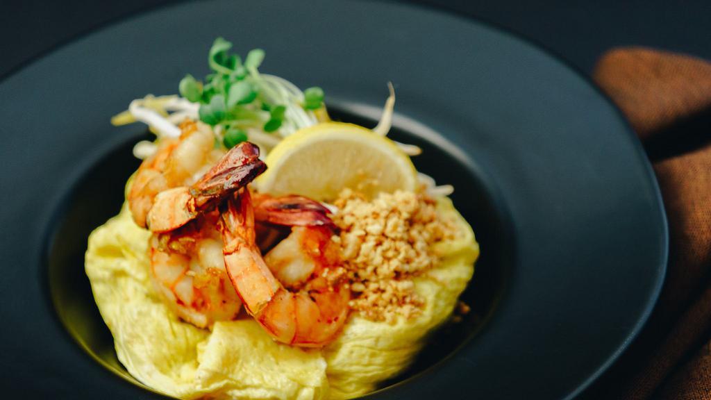 Pad Thai · Stir-fried noodles with jumbo prawns , bean sprouts, chives tofu and ground peanuts.