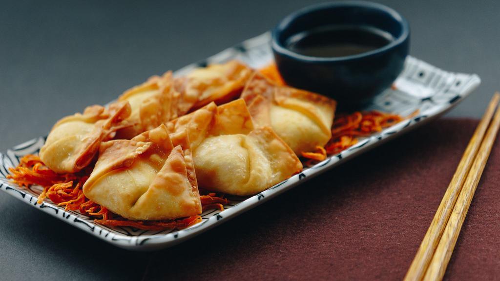 1. Crab Wonton · Crab meat blended with cream cheese, green onion, water chesnut and sweet sour fried crispy in wonton wrappers.