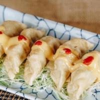 Gyoza · Deep fried wonton filled with coleslaw mix, sesame oil, and soy sauce, served with spicy mayo