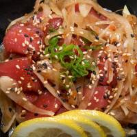 Hawaiian Poki Salad · tuna marinated in soy based sauce, topped with onion, sesame seed green onion and tobiko