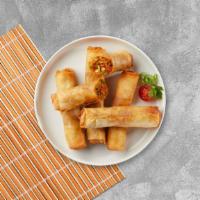 Spring Me Down · Fried spring rolls filled with mixed vegetables, served with sweet & sour sauce.