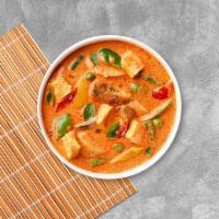 Red Curry Conception · Red curry with bamboo shoots, bell peppers, and basil cooked in coconut milk.