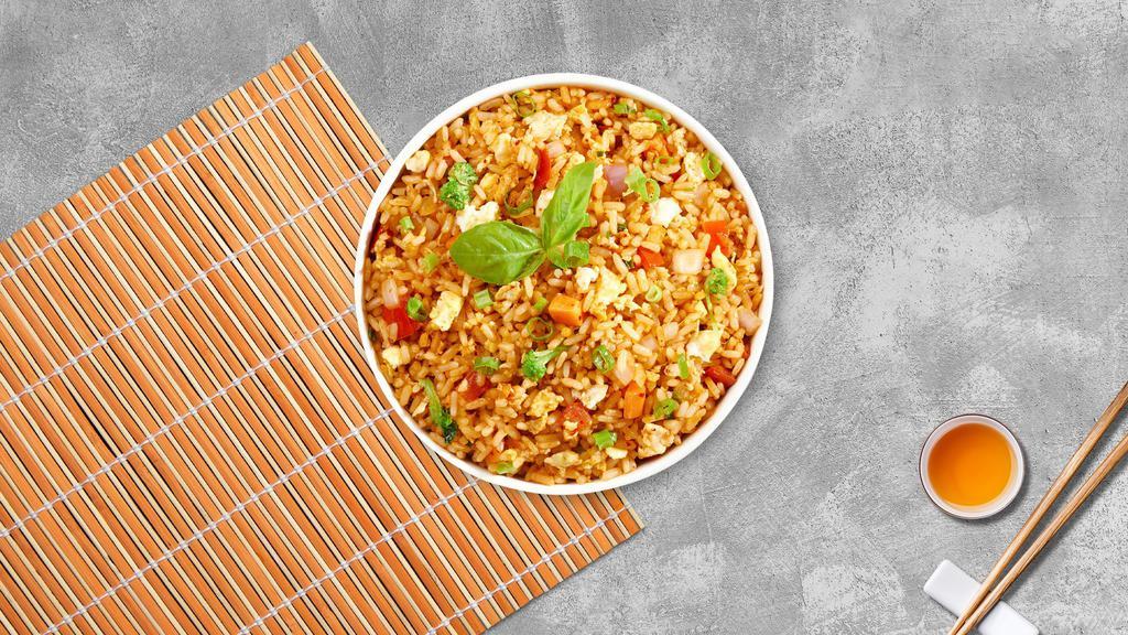 Upper East Fried Rice · Fried rice with green peas, carrots, onions, and egg.