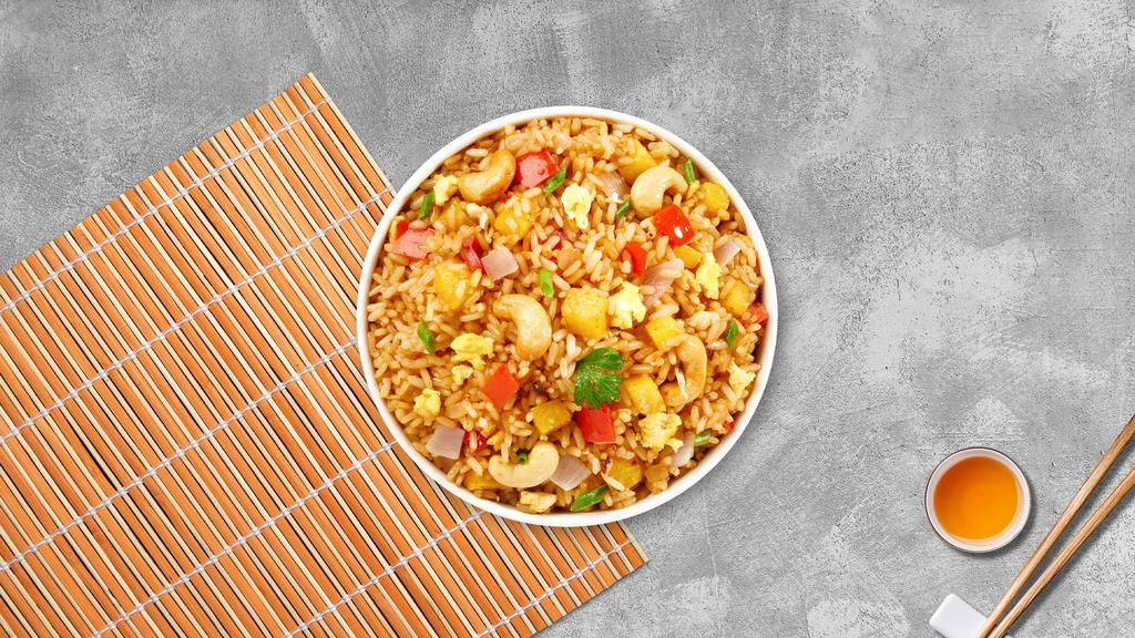 Project Power Pineapple Fried Rice · Combination fried rice of prawns and chicken with fresh pineapple, cashew nuts, raisins, carrots, green peas, and onions.