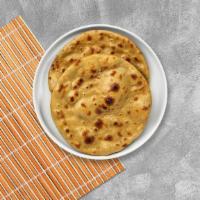 Roti · Wholewheat Indian bread cooked in a clay oven.
