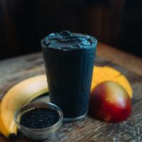 Charcoal Coconut Smoothie · Mango*, banana*, activated charcoal*, almond coconut milk*, sesame seeds*, *organic