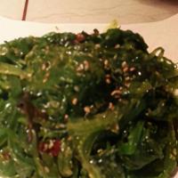 Seaweed Salad (GF) · Wakame salad with a sesame dressing on a bed of arugula