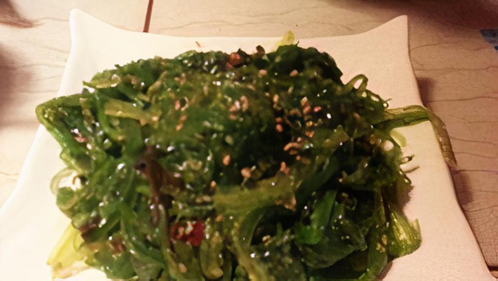 Seaweed Salad (GF) · Wakame salad with a sesame dressing on a bed of arugula
