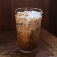 Iced Caffe Latte · Double shot of Red Bay Coffee espresso poured over ice. Choice of dairy milk or oat milk.