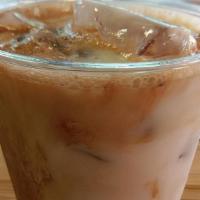 Iced Matcha Latte · Organic matcha, choice of milk, and honey poured over ice.