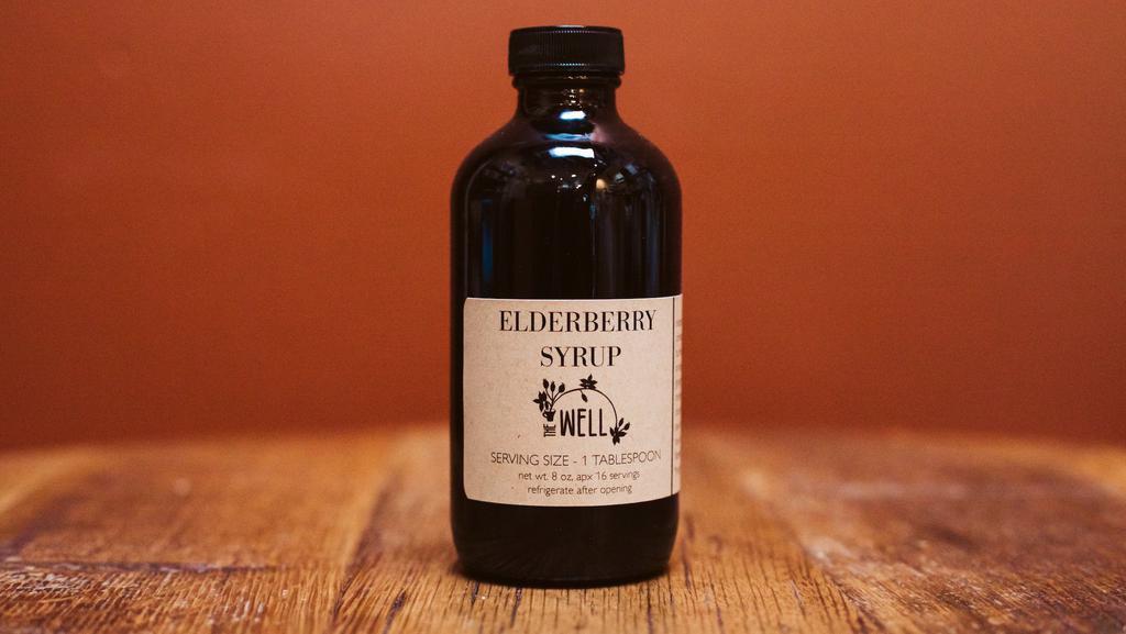 Elderberry Syrup · A wellness syrup made from elderberries*, turmeric*, rosehips*, orange peel*, cinnamon*, ginger root*, honey, apple cider vinegar*, and filtered water (*organic).