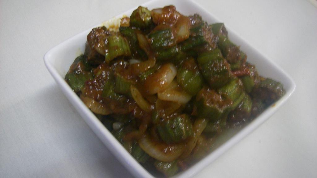 Bhindi Masala · Vegan. Stir fried fresh okra sautéed with onion, garlic & spices.