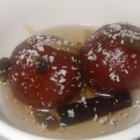 Gulab Jamun · Milk dumplings in a saffron flavored syrup.