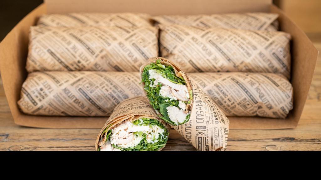 Grilled Chicken Caesar Wrap Platter · Organic air chilled chicken breast with seasonal greens & Parmesan cheese wrapped up in our multigrain tortilla. Platter includes 10 whole wraps & 2 sides of our signature sauces.