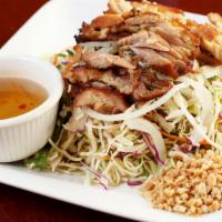 17. Cabbage Salad with Chicken · Shredded cabbage, carrots, cucumber, mint, peanuts and fried shallots.