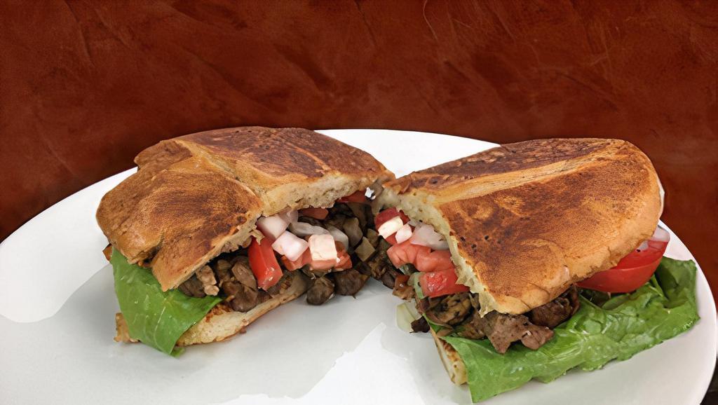 Torta (Mexican Sandwich) · Cheese, lettuce, mayo, onion, tomato on french bread with choice of meat. (steak, grilled chicken, carnitas, al pastor).