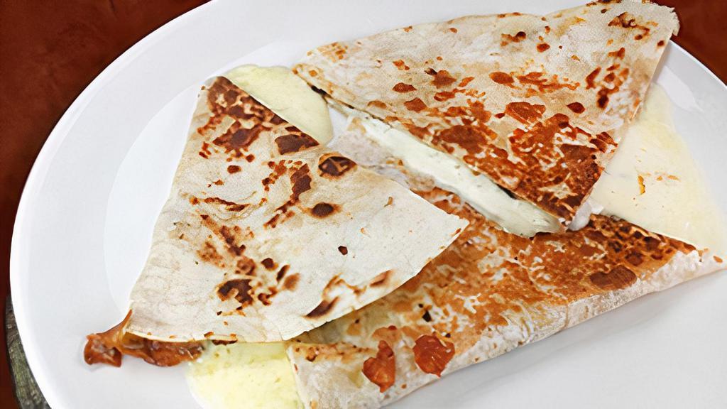 Plain Quesadilla · Flour tortilla and monterey jack cheese