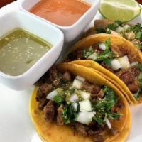 Taco Truck Tortilla · Cilantro, onion, salsa, and choice of meat. (steak, grilled chicken, carnitas, al pastor).
