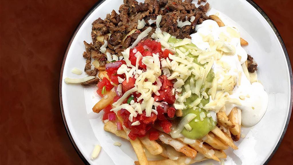 Super Steak Fries · French fries, cheese, sour cream, guacamole, pico de gallo and choice of meat. (steak, grilled chicken, carnitas, al pastor).