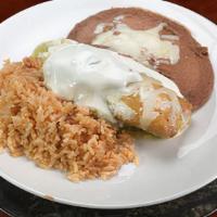 1 Tamale · With green or red sauce, rice, beans cheese, sour cream, salsa, choice of meat and corn or f...