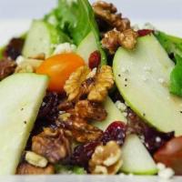 Spinach Salad · Baby spinach leaves topped with gorgonzola cheese, fresh marinated pears, cherry tomatoes, w...