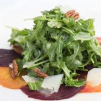 Beets Salad · Served with arugula, toasted pecans, shaved parmesan, champagne vinaigrette dressing.