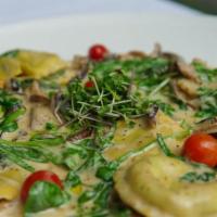 Porcini Mushroom Ravioli · Porcini’s, roasted cherry tomatoes, fresh spinach, in a light marsala cream sauce.