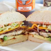California Chicken Club Sandwich · Grilled chicken breast, bacon, cheese, avocado, lettuce, tomato, mayo, and mild BBQ sauce. H...