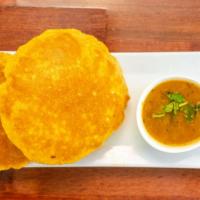 Bedmi Puri with Aaloo Bhaji · Spicy masala potato curry served with lentil puffed bread.