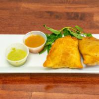 Vegetable Samosa (2 Pieces) · Deep-fried pastry with a savory filling of spiced potatoes, onions and peas.