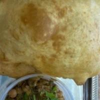 Chole Puri · Flavorful chickpea curry served paired with puffy puffed bread.
