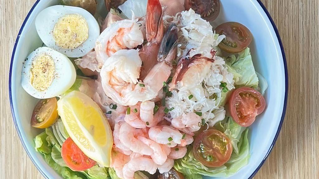 Seafood Louis Salad · Dungeness crab, bay shrimp, prawns, hard boiled egg, Louis dressing, iceberg lettuce