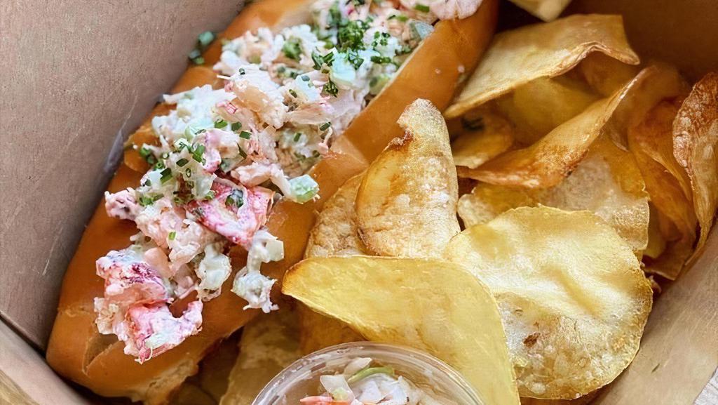 Lobster Roll · 3oz of Maine lobster tossed with lemon aioli served on a toasted roll, chips, coleslaw