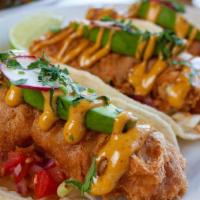 Baja Fish Tacos · Fried Alaskan cod, flour tortillas, avocado, cabbage, pico de gallo, lemon aioli, chipotle a...