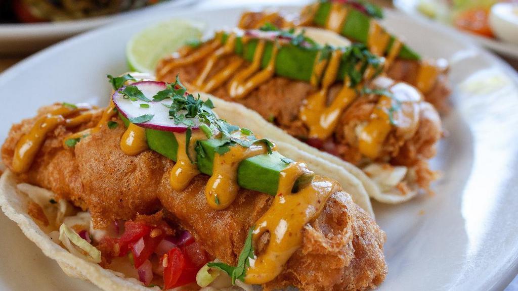 Baja Fish Tacos · Fried Alaskan cod, flour tortillas, avocado, cabbage, pico de gallo, lemon aioli, chipotle aioli