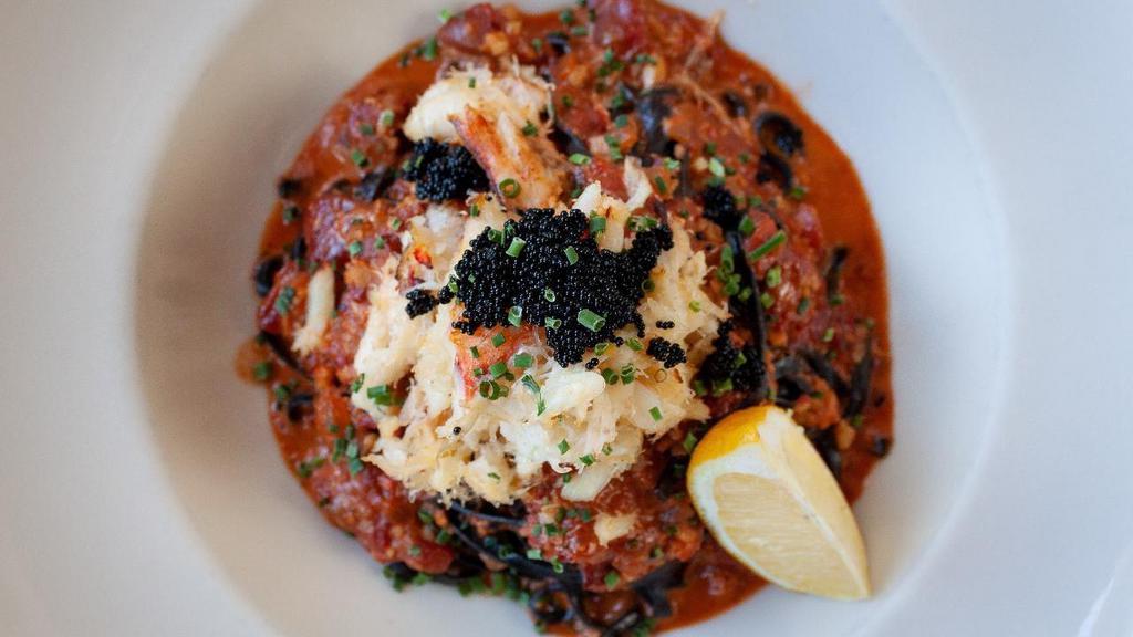 Squid Ink Linguini · Dungeness crab, smoked tomato sauce, tobiko