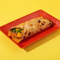 Chana Masala Roll · With sliced onions and your choice of chutney in a roti roll.