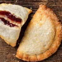 Cherry Hand Pie · Flakey pie crust filled with cherries and nutmeg.