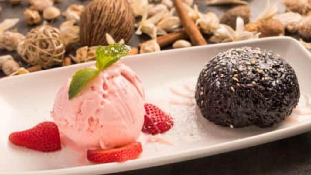 (C) Home Made Sweet Sticky Rice · Black sticky rice sweetened with brown sugar, served with coconut milk and choice of vanilla, strawberry, mango or coconut ice cream.