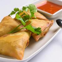 Samosas · Vegetarian. Flour turnover filled with potatoes, red onions, peas, carrots and a blend of un...
