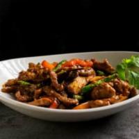 Fiery Lamb Tofu · Lamb wok fried with tofu, string beans, bell pepper and basil in a sweet and spicy sauce.