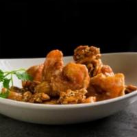 Walnut Shrimp · Lightly fried shrimp wok tossed with creamy sweet sauce, topped with toasted walnuts and ses...