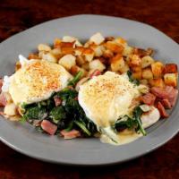 Costa Del Sol · Sautéed ham, spinach and onions with poached eggs on an English muffin with hollandaise sauce.