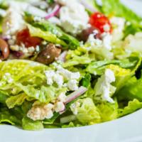Athena Salad · Romaine lettuce, tomatoes, cucumbers, kalamata olives, red onions and feta tossed with orega...
