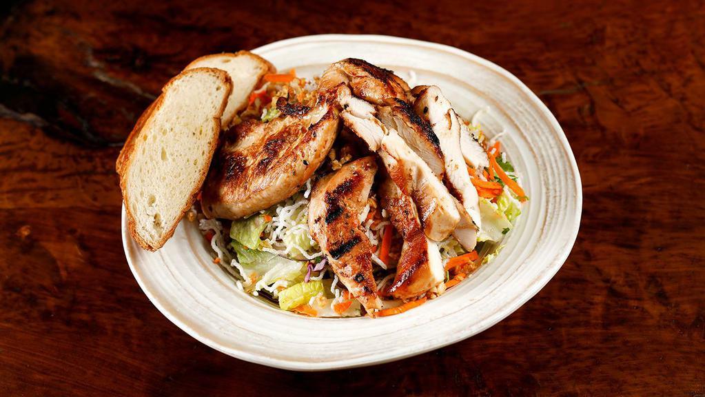 Asian Chicken Salad · Rice noodles, cabbage, romaine lettuce, red onions cucumbers, carrots, cilantro and peanuts tossed with Asian dressing.